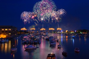 BAY CITY, MI - JULY 7: Fireworks explode over the river and downtown area during a July Fourth celebration on July 7, 2012 in Bay City, Michigan